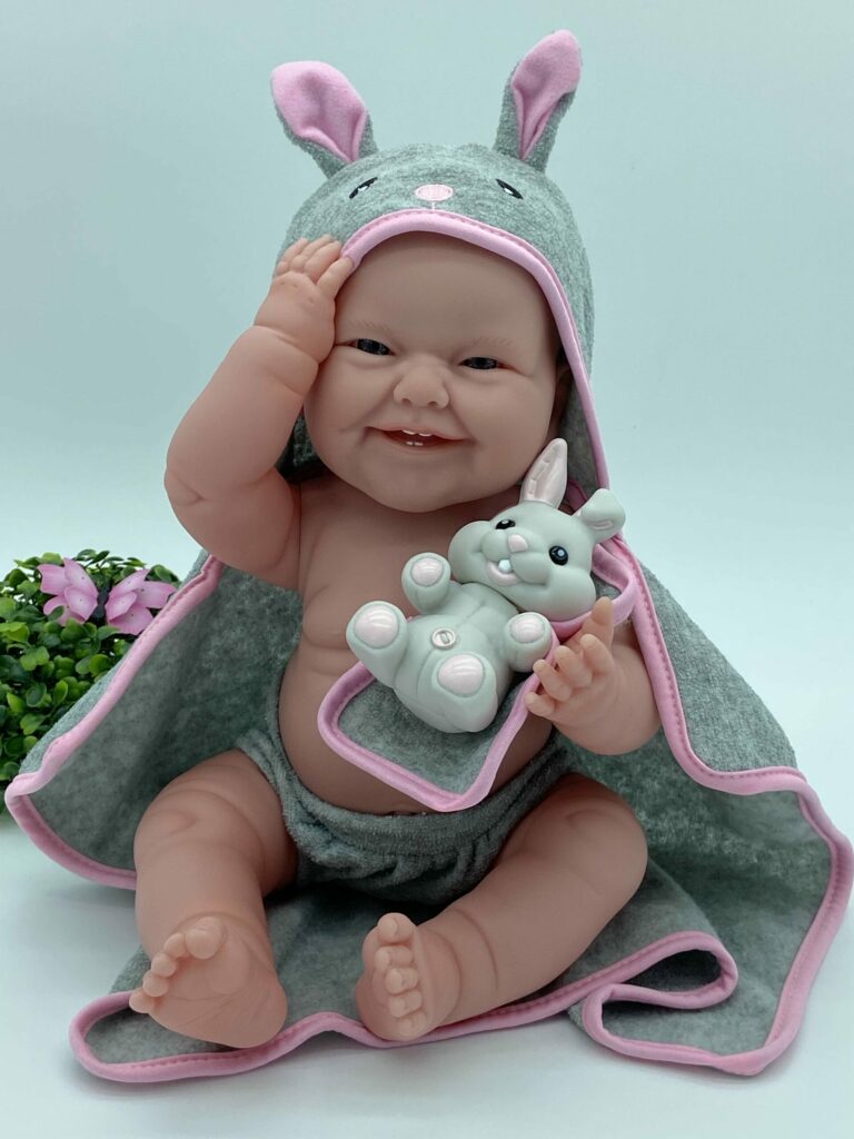 MUÑECA CUERPO DE VINILO SONRISA DIENTECITOS GRIS/ROSA