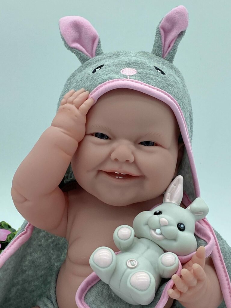 MUÑECA CUERPO DE VINILO SONRISA DIENTECITOS GRIS/ROSA
